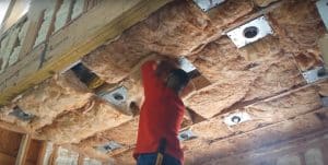 Ultimate Radiant Barrier installers fitting attic insulation in a Houston home
