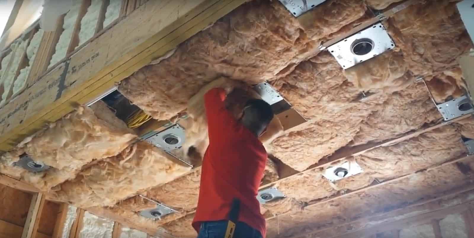 Ultimate Radiant Barrier installers fitting attic insulation in a Houston home