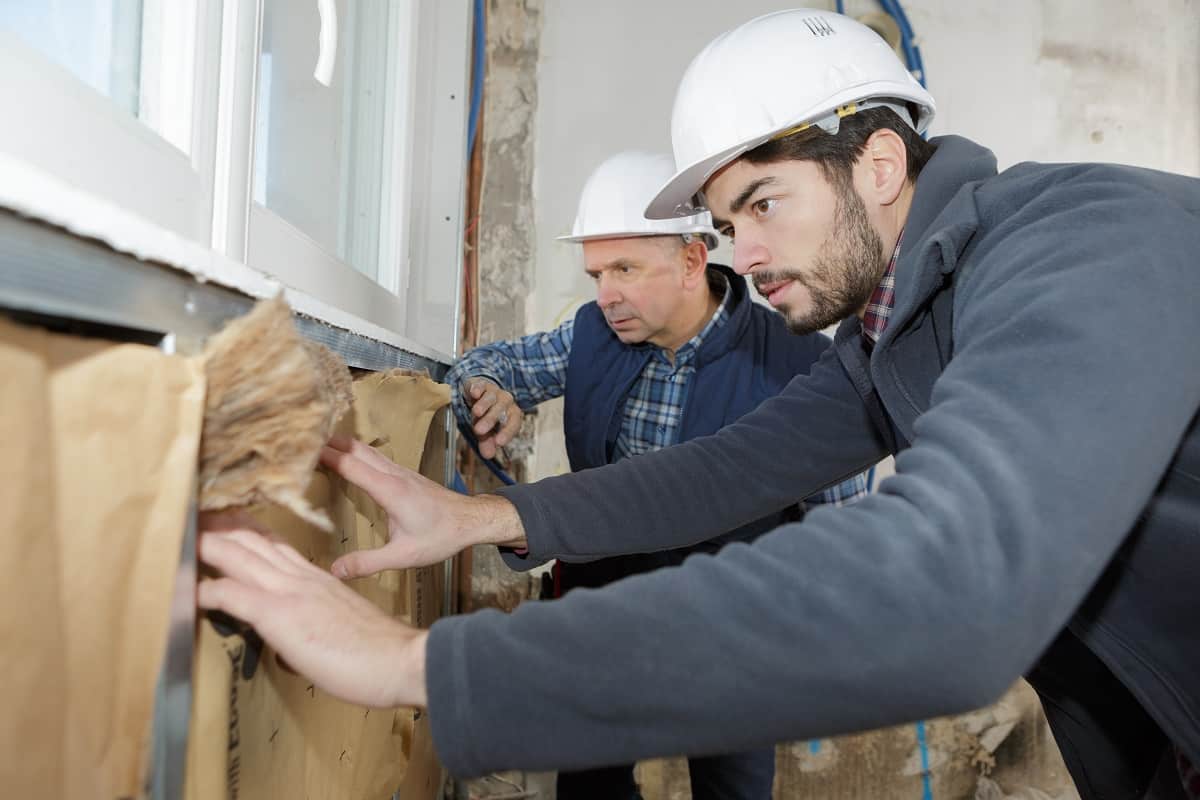 Professional Greater Houston insulation contractors inspecting a home